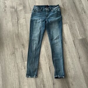 Buckle black skinny jeans.